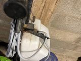 a green and black vacuum cleaner and a green and white mop
