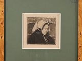 an old picture of a woman with a bonnet in a frame