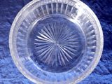 a clear glass bowl with a starburst design on it