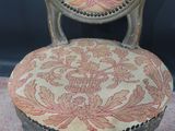 a close up of a chair with a floral pattern on it