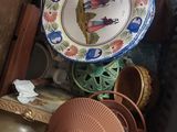 many different plates and bowls on a shelf
