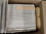 a box full of old papers and a piece of paper