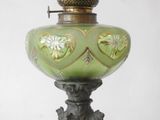 a green lamp that is sitting on a table