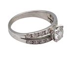 an image of a diamond ring with a flower on top of it