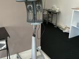 a hair dryer sitting on a stand in the corner of a room