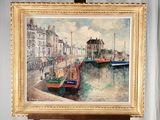 a picture of a painting on a easel by the water