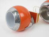 pair of orange and silver lamps on a white surface