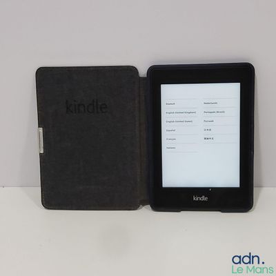 a kindle next to a kindle book on a table