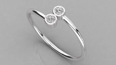 une bague en or blanc sertie de deux diamants