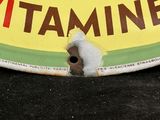 a yellow and green sign that says vitamins on it