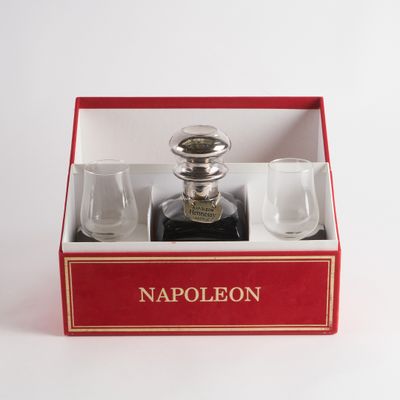 a red box with a bottle of liquor and glasses in it