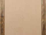 an empty picture frame with a brown background