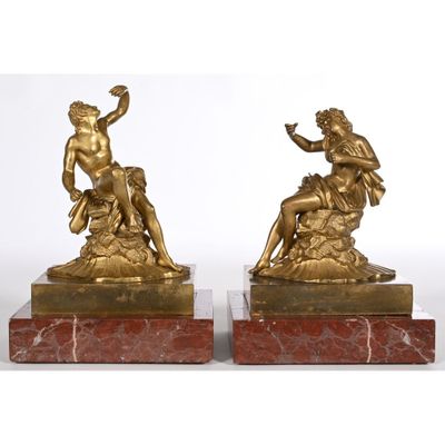 pair of antique bronze figurines of a man and woman on marble bases