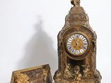 a clock that is sitting next to a box