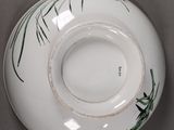 a white bowl with a floral design on it