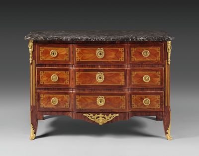 an antique chest of drawers with marble top