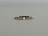 a close up of a ring on a table with a white background