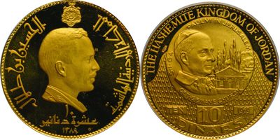 a close up of a gold coin with a portrait of a man