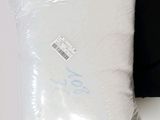 two pillows that are sitting next to each other on a table