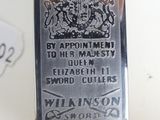 a silver plaque with a crown on it on a table