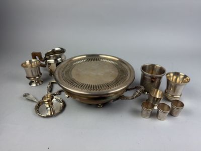 an assortment of silverware including cups, spoons and cups
