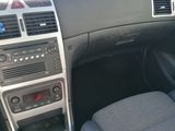 the interior of a car with a steering wheel and dashboard controls
