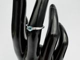 an image of a hand with a ring on it ' s finger