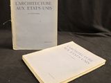 two books on a black cloth with a black background