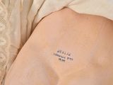 a tattoo on the arm of a woman that has a message on it