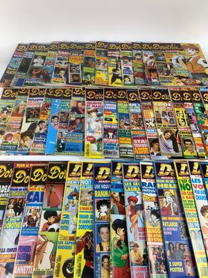 a pile of magazines sitting on top of each other on a table