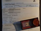 a document with a picture of a medal and a coin on it