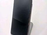 a phone that is sitting on top of a stand