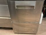 stainless steel dishwasher and oven in a kitchen with wooden flooring
