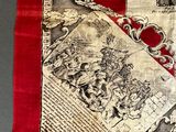 a red and white scarf with a heart on it