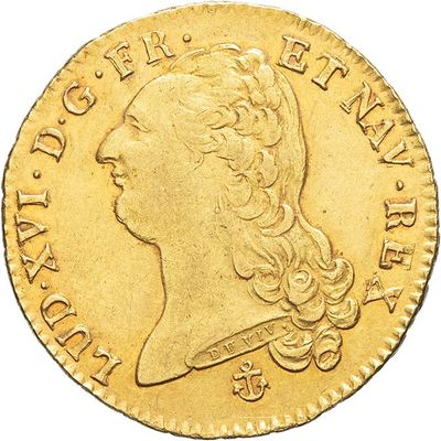 a close up of a gold coin with a woman ' s head