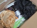 a box full of hair and a wig in it