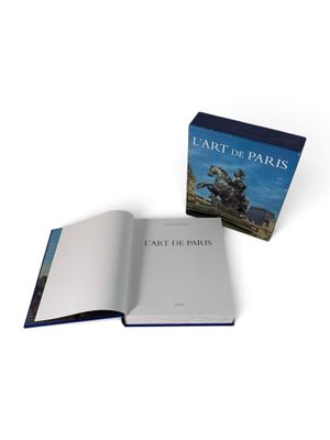 an open book with a picture of a statue on it