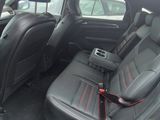 the interior of a car with a seat belt in the back of it