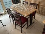 bottles of wine are lined up on a table in a restaurant