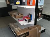 a shelf with a lot of boxes on it in a store