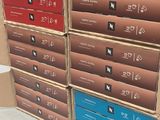 several cardboard boxes stacked on top of each other in a room