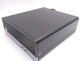 an image of a small black computer sitting on top of a white surface
