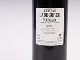 a bottle of wine that is sitting on a table