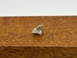 a small diamond ring on top of a wooden box