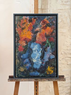 a painting of flowers in a vase on a easel