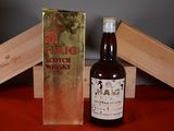 a bottle of alcohol sitting next to a box of wine