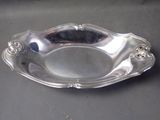 a silver plate that is sitting on a table