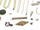 many different types of jewelry on a white surface
