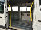 a white van with its doors open on the side of the road