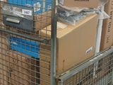 a metal cart with boxes on top of it